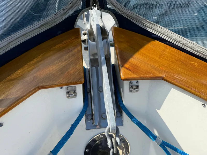 Slide: The Image of 1978 Fisher 38 Trawler bow with polished wood and anchor chain. - 45