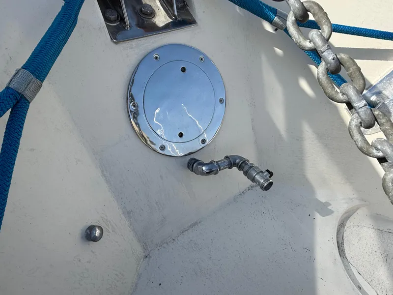 Slide: The Image of 1978 Fisher 38 Trawler deck with metal fittings and blue ropes. - 46