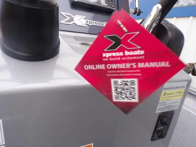 Slide: The Image of 2025 Xpress SW20B boat with owner's manual tag and QR code. - 11