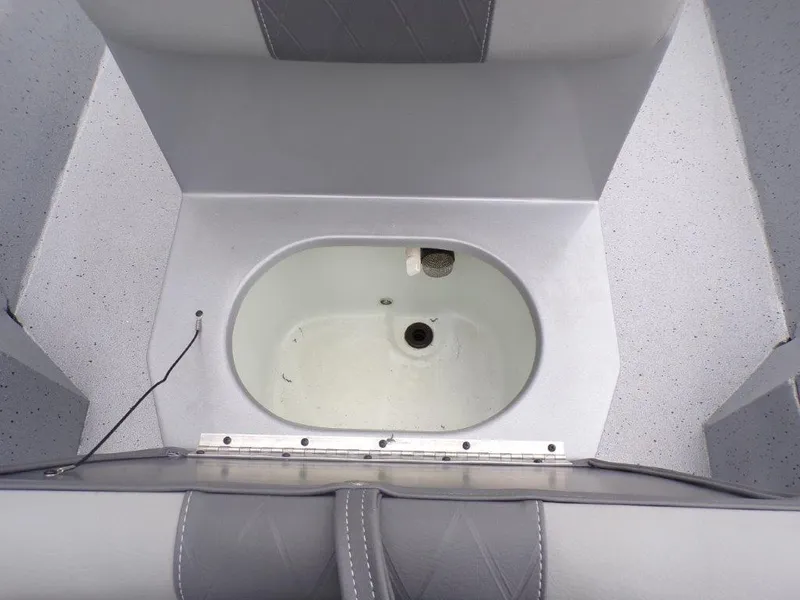 Slide: The Image of 2025 Xpress SW20B boat livewell with gray seating and white interior. - 12