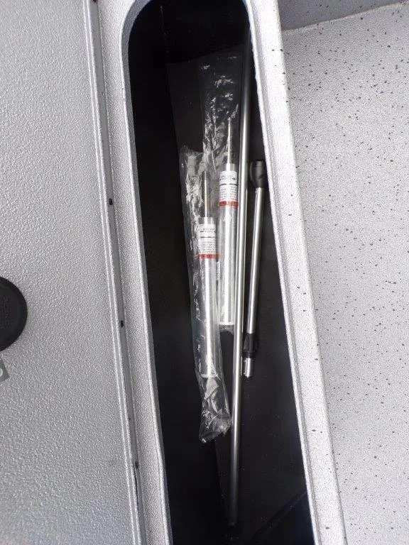 Slide: The Image of Storage compartment in 2025 Xpress SW20B boat with metal rods inside. - 13