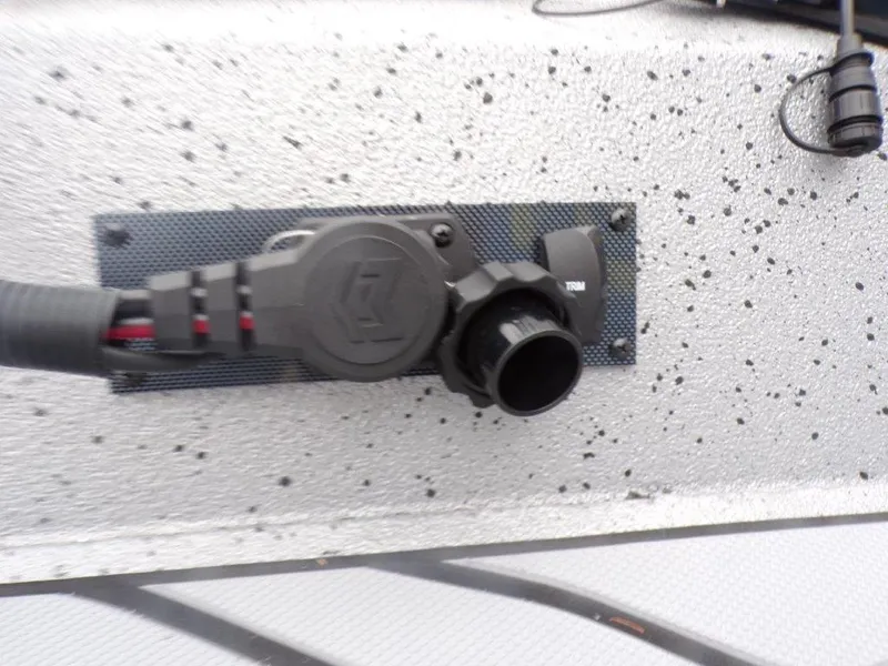 Slide: The Image of Close-up of a 2025 Xpress SW20B boat's electrical connector on a speckled surface. - 14