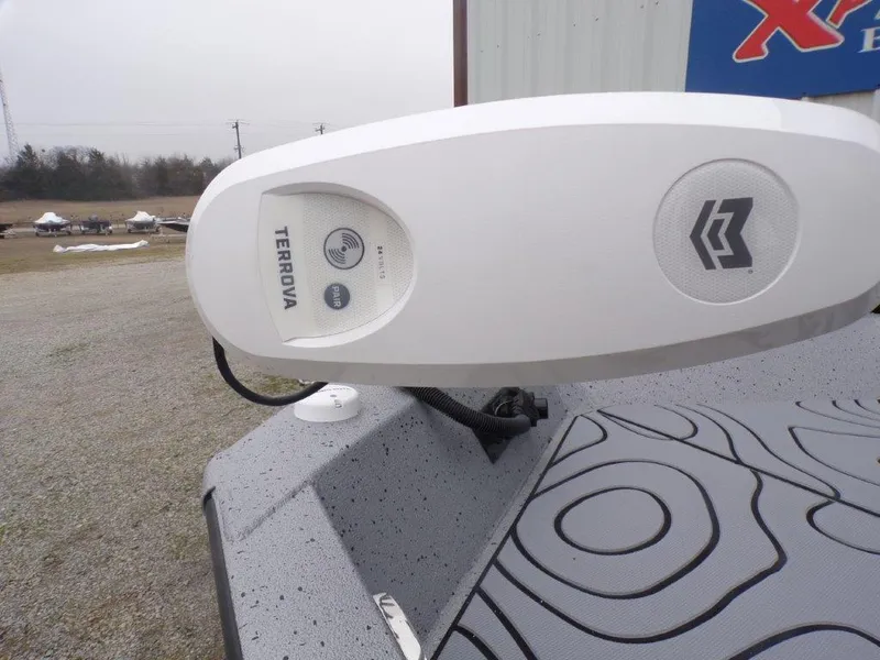 Slide: The Image of 2025 Xpress SW20B boat with Terrova trolling motor, outdoor setting. - 15