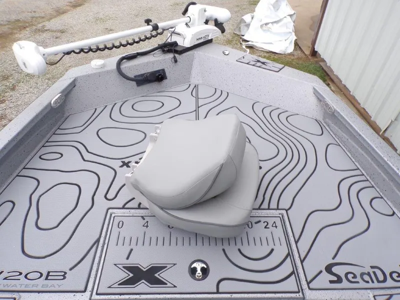 Slide: The Image of 2025 Xpress SW20B boat deck with seat and trolling motor. - 16