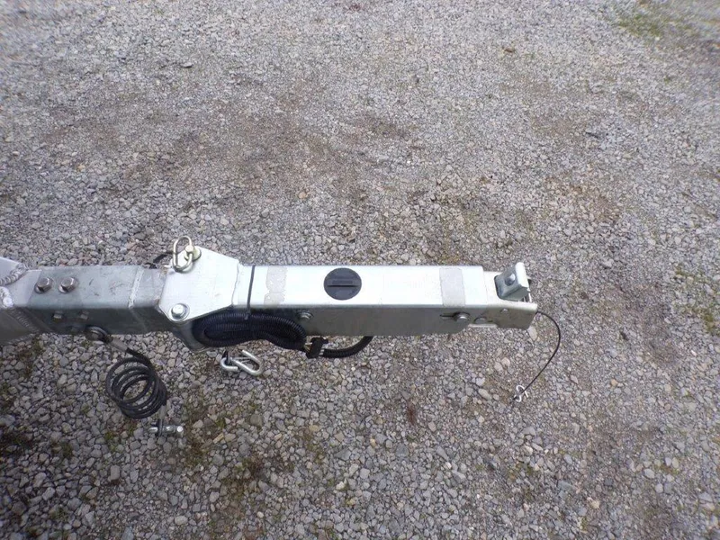Slide: The Image of Trailer hitch of 2025 Xpress SW20B on gravel surface. - 19