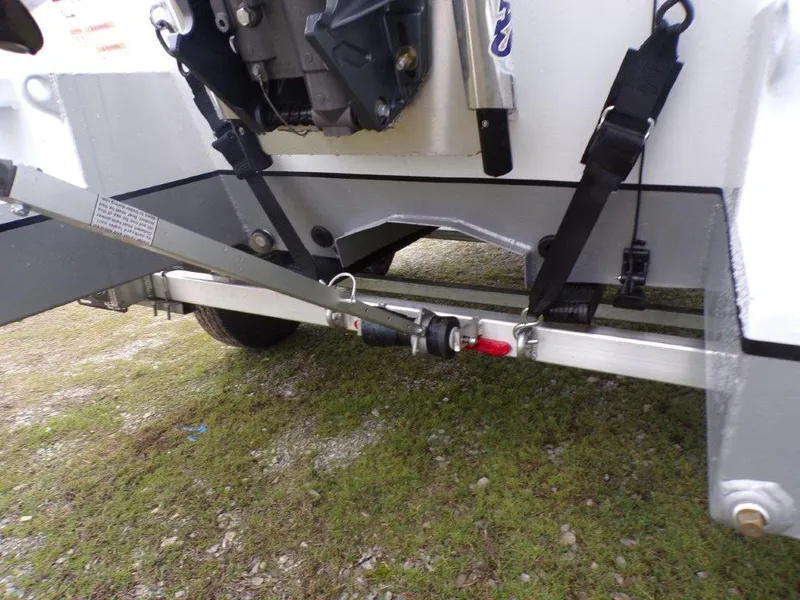 Slide: The Image of 2025 Xpress SW20B trailer hitch and suspension system on grassy ground. - 20