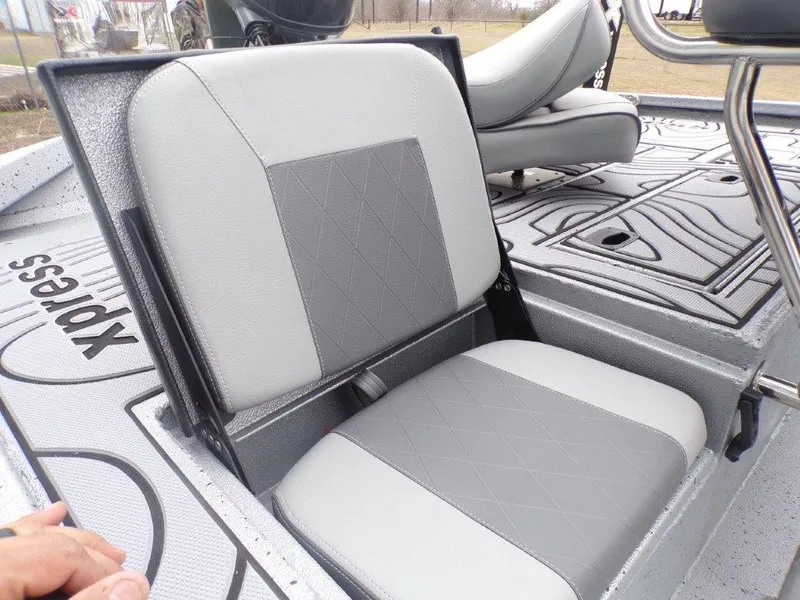 Slide: The Image of 2025 Xpress SW20B boat seat with gray upholstery and diamond pattern design. - 24