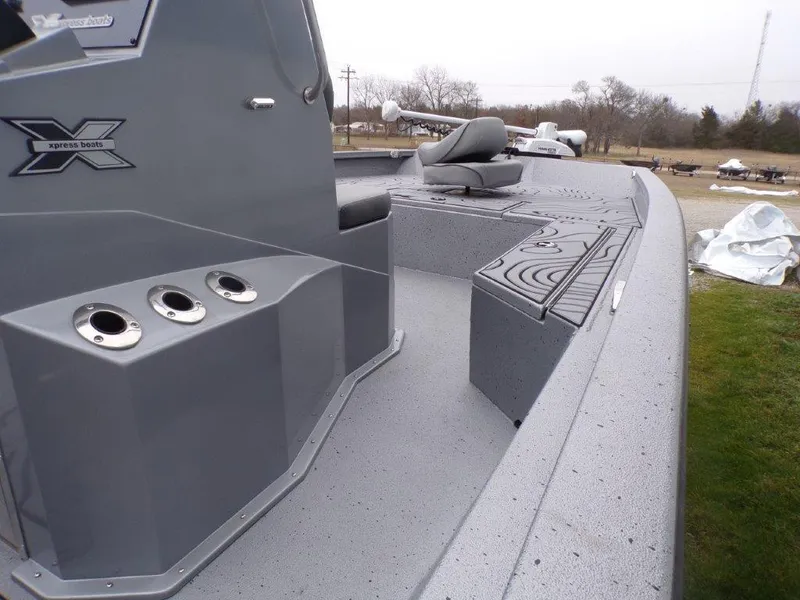 Slide: The Image of 2025 Xpress SW20B boat deck with seating and storage compartments. - 26