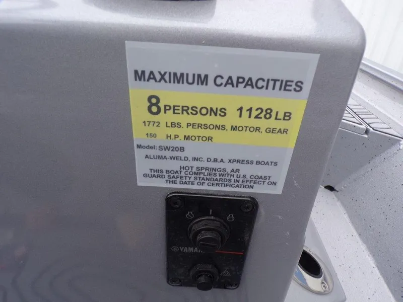 Slide: The Image of Maximum capacity label on 2025 Xpress SW20B boat, 8 persons, 1128 lbs, 150 HP motor. - 9