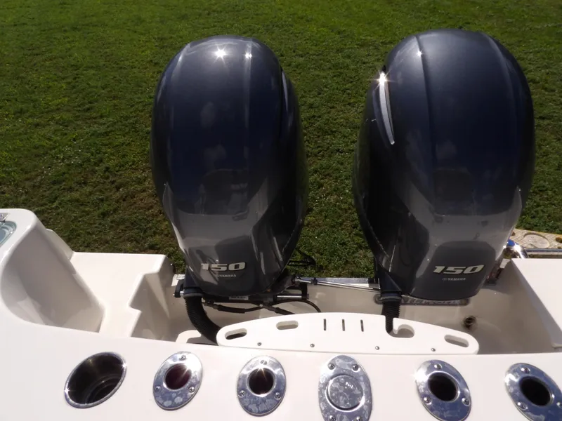 Slide: The Image of Twin 150 horsepower engines on a 2020 Sailfish 275 DC boat. - 10