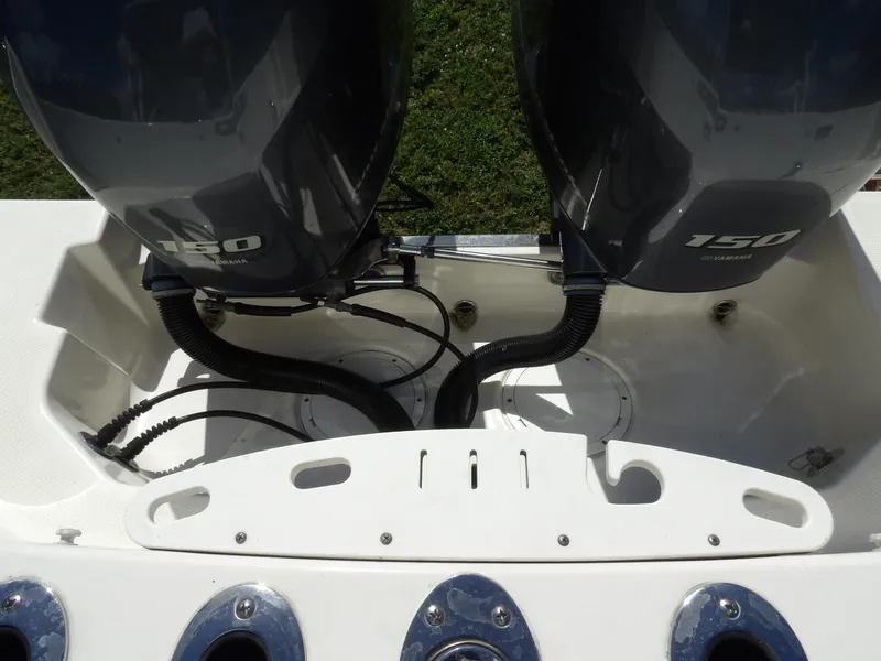 Slide: The Image of 2020 Sailfish 275 DC boat with twin 150 horsepower engines, rear view. - 11