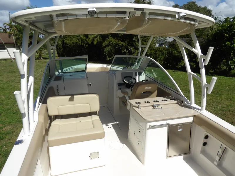 Slide: The Image of 2020 Sailfish 275 DC boat interior with seating and helm station. - 13