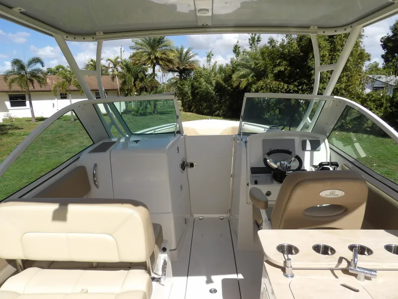 Slide: The Image of 2020 Sailfish 275 DC boat interior with seating and steering console. - 14