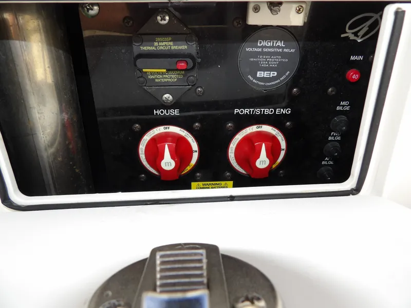 Slide: The Image of Control panel of a 2020 Sailfish 275 DC boat with battery switches and digital display. - 22