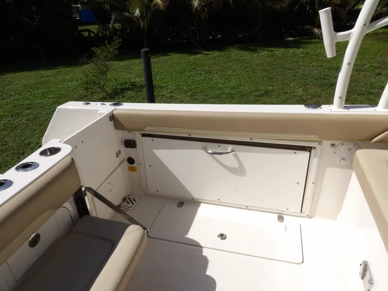 Slide: The Image of Interior view of 2020 Sailfish 275 DC boat, featuring seating and storage compartment. - 23