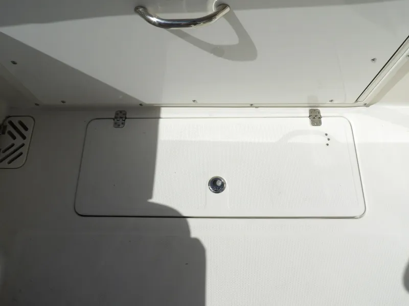 Slide: The Image of 2020 Sailfish 275 DC boat deck hatch with handle and latch. - 25