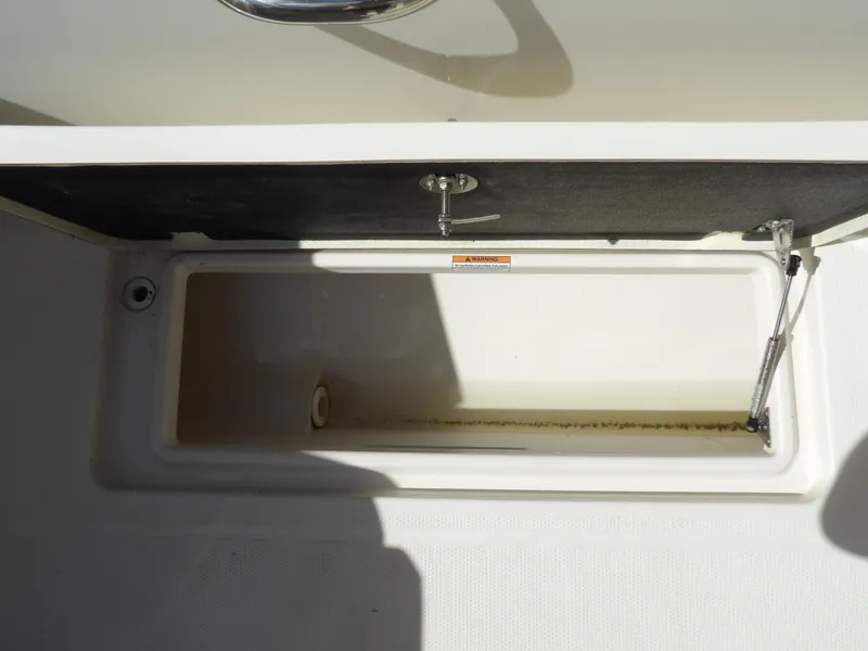 Slide: The Image of Open storage compartment on 2020 Sailfish 275 DC boat. - 26