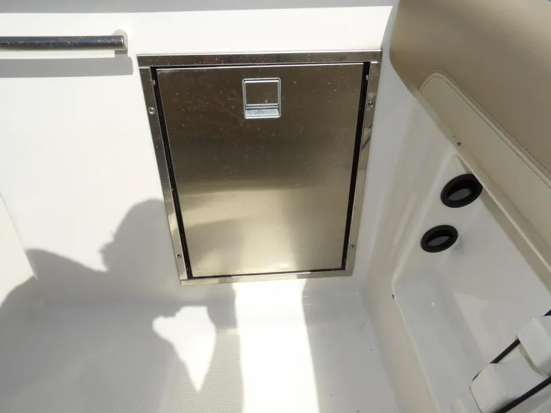 Slide: The Image of Stainless steel storage compartment on 2020 Sailfish 275 DC boat interior. - 27