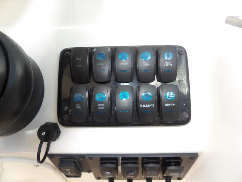 Slide: The Image of Control panel of 2020 Sailfish 275 DC boat with labeled switches. - 40