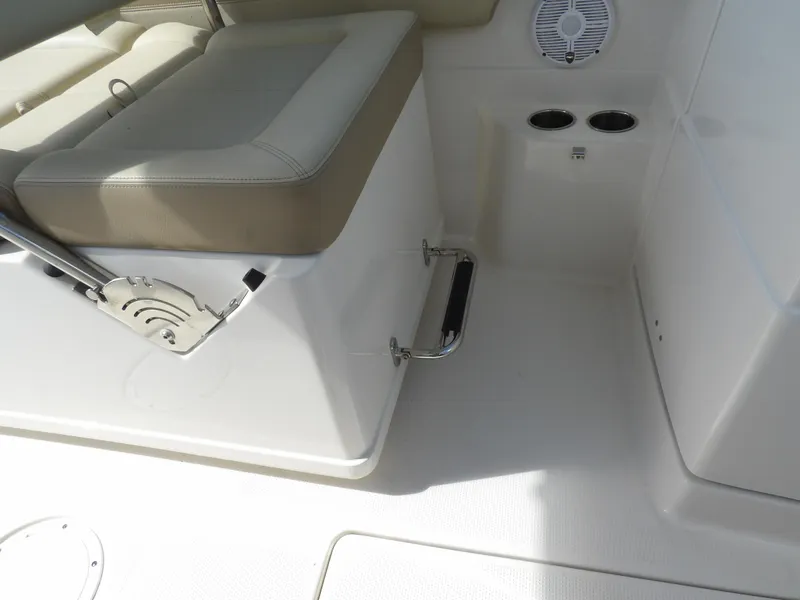 Slide: The Image of 2020 Sailfish 275 DC boat interior with seating, cup holders, and speaker. - 46
