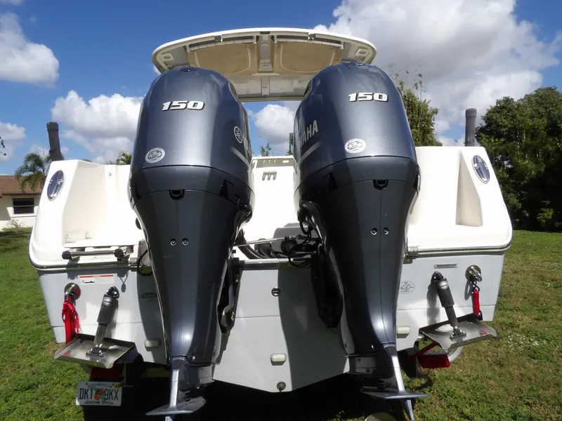 Slide: The Image of 2020 Sailfish 275 DC boat with dual Yamaha 150 engines, rear view. - 9