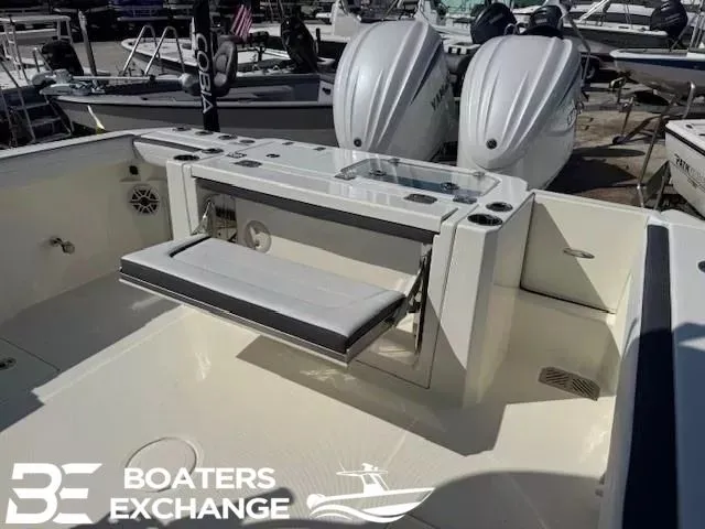 Slide: The Image of Cobia 285 Open Center Console 2025 with dual engines and bench seat. - 6