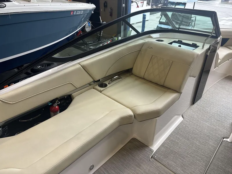 Slide: The Image of Interior of 2019 Regal 2300 RX Surf boat with beige seating and modern design. - 11
