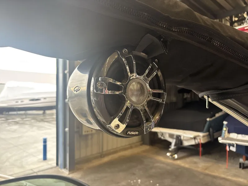 Slide: The Image of Fusion speaker on a 2019 Regal 2300 RX Surf boat, in a garage setting. - 14