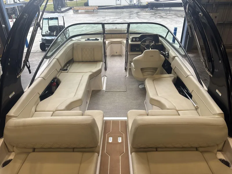Slide: The Image of 2019 Regal 2300 RX Surf boat interior with beige seating and modern dashboard. - 6