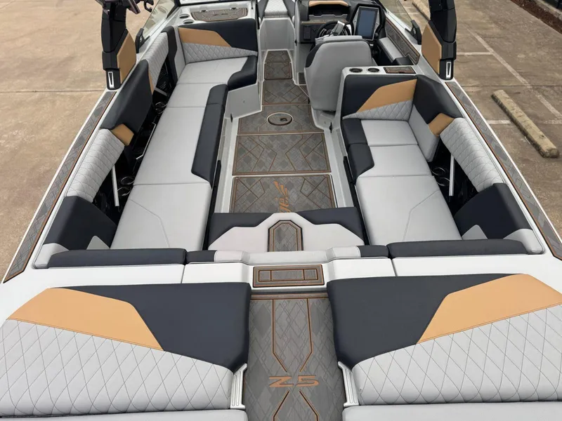 Slide: The Image of 2023 Tigé Z5 boat interior with luxurious seating and modern design. - 11