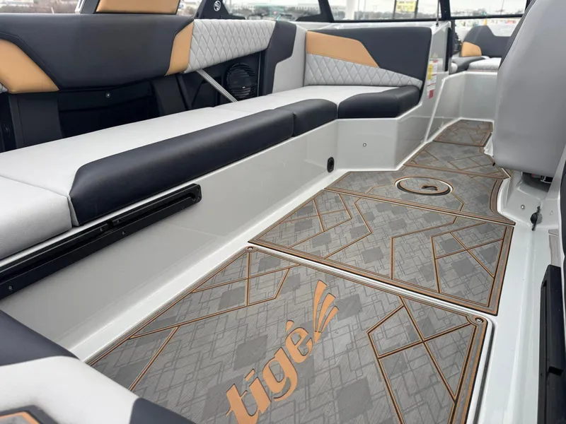Slide: The Image of 2023 Tigé Z5 boat interior with stylish seating and custom flooring design. - 12