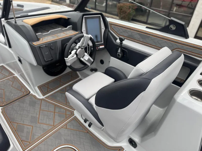 Slide: The Image of 2023 Tigé Z5 boat interior with modern dashboard and steering wheel design. - 17