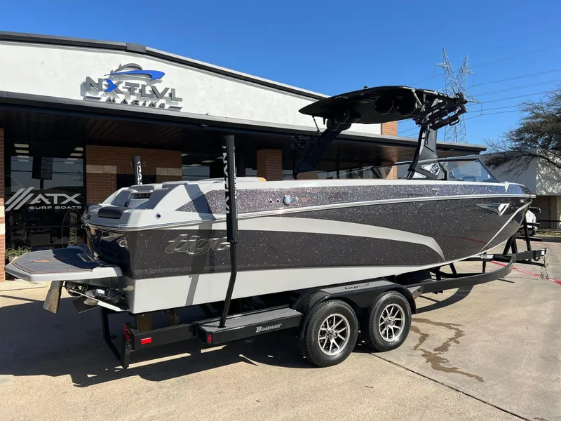 Slide: The Image of 2023 Tigé Z5 boat on trailer at Next Level Marine dealership. - 3
