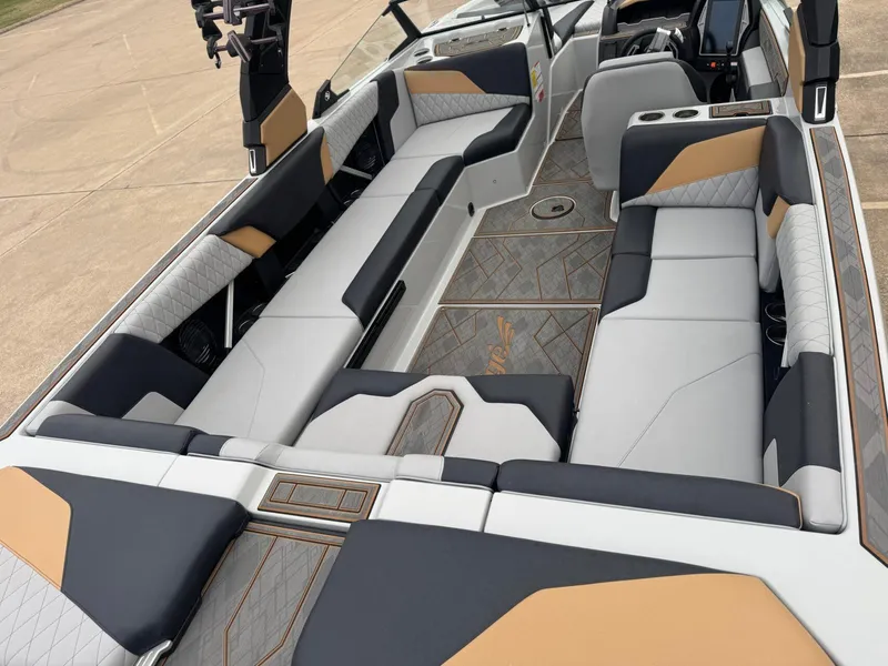 Slide: The Image of 2023 Tigé Z5 boat interior with luxurious seating and modern design. - 9