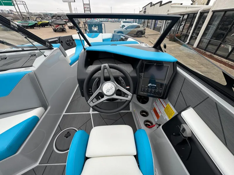 Slide: The Image of 2024 ATX Surf Boats 22 Type-S interior with modern dashboard and steering wheel. - 11