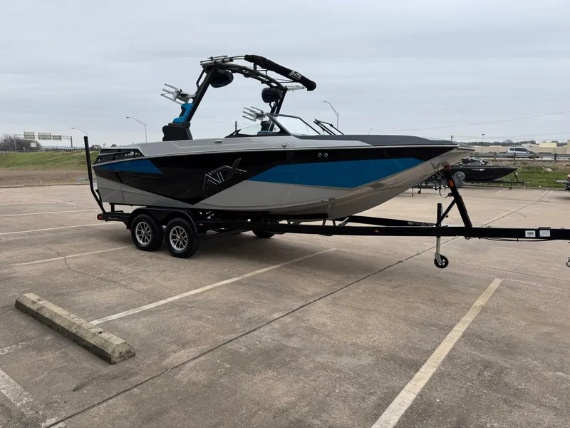 Slide: The Image of 2024 ATX Surf Boats 22 Type-S on trailer in parking lot. - 3