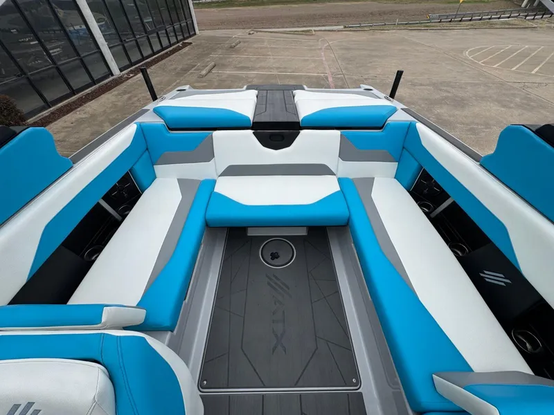 Slide: The Image of 2024 ATX Surf Boats 22 Type-S interior with blue and white seating. - 6