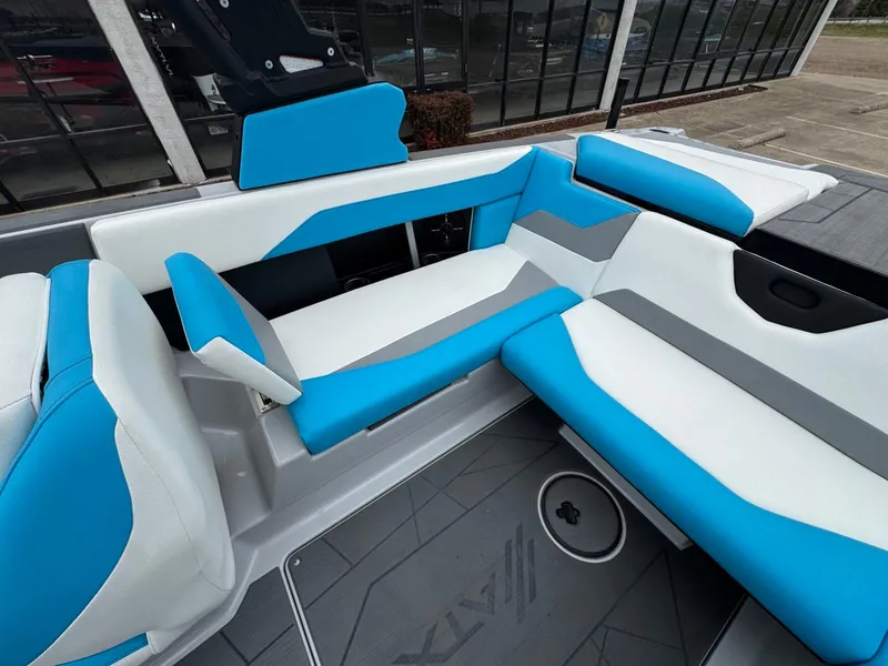 Slide: The Image of 2024 ATX Surf Boats 22 Type-S interior with blue and white seating. - 7