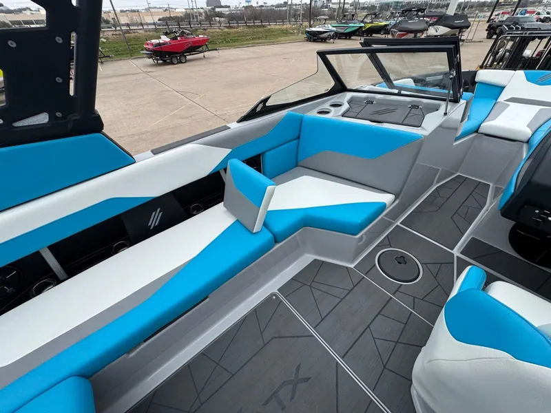 Slide: The Image of 2024 ATX Surf Boats 22 Type-S interior with blue and white seating, modern design. - 9
