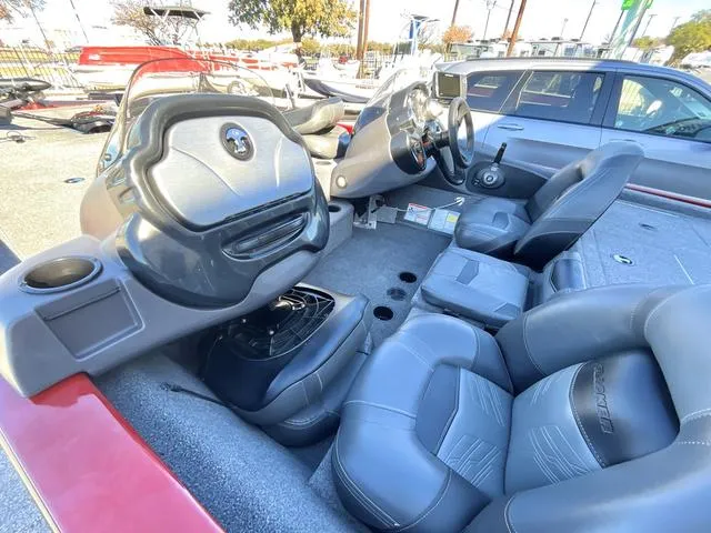 Slide: The Image of 2020 Tracker 195TXW boat interior with steering wheel, seats, and dashboard. - 10