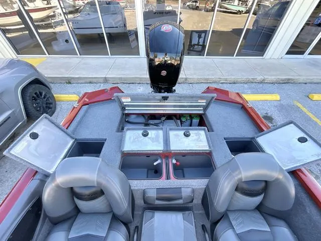 Slide: The Image of 2020 Tracker 195TXW boat interior with storage compartments and seating. - 12