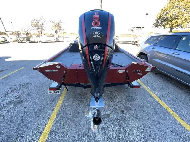Slide: The Image of 2020 Tracker 195TXW boat with 150 HP engine in parking lot. - 4
