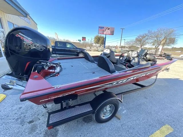 Slide: The Image of 2020 Tracker 195TXW boat with Mercury Pro XS engine on trailer, parked outdoors. - 9