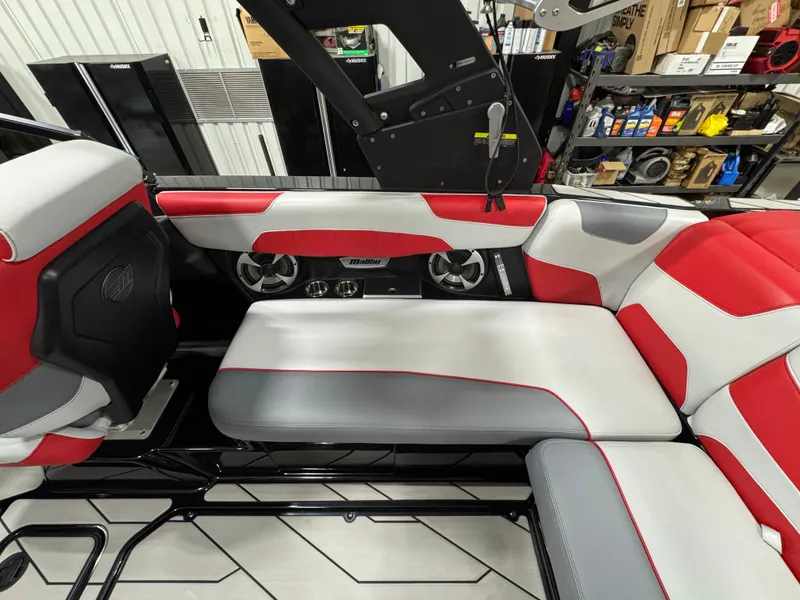 Slide: The Image of 2020 Malibu Wakesetter 22 LSV interior with red and gray seating, showcasing modern design. - 13
