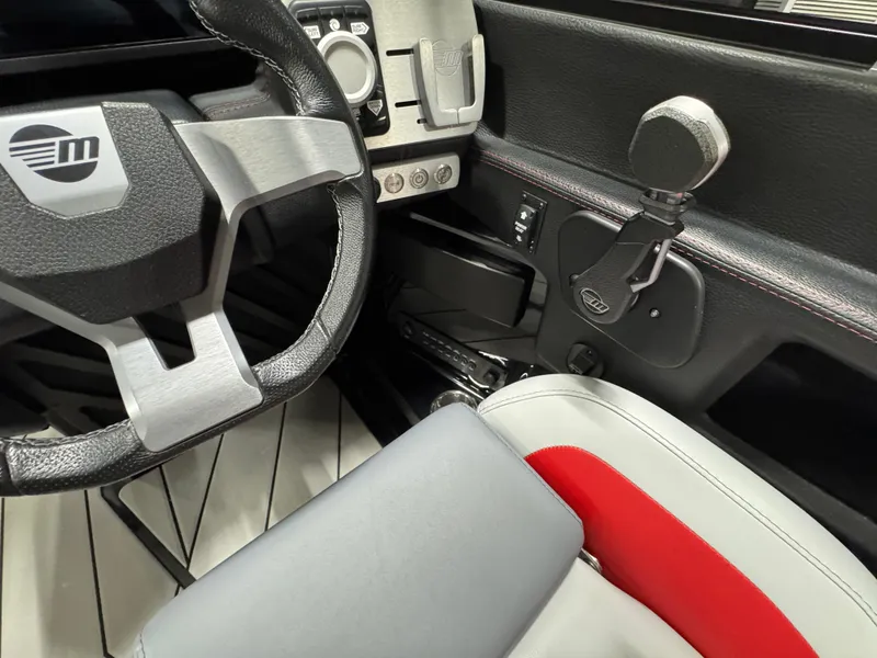 Slide: The Image of 2020 Malibu Wakesetter 22 LSV interior, featuring steering wheel and control panel. - 16