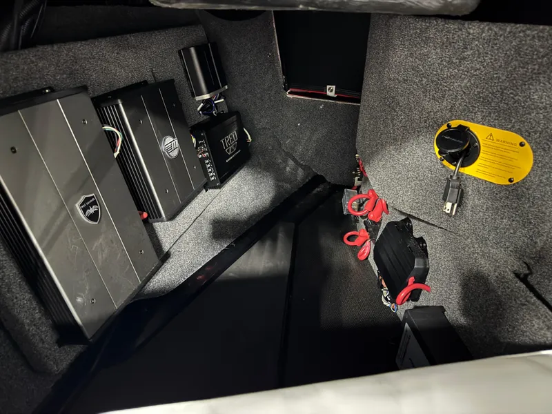 Slide: The Image of 2020 Malibu Wakesetter 22 LSV interior showing audio system components and wiring. - 19