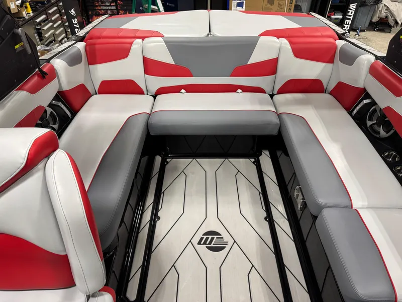 Slide: The Image of 2020 Malibu Wakesetter 22 LSV interior with red and gray seating, stylish design. - 21