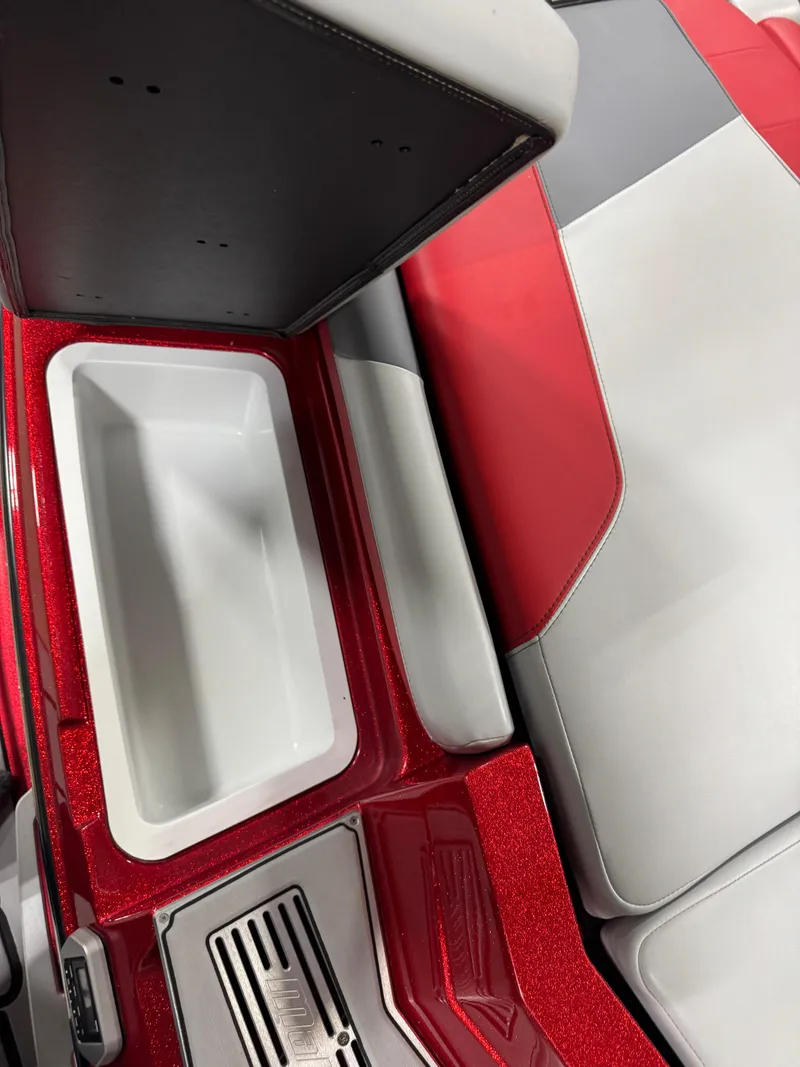 Slide: The Image of 2020 Malibu Wakesetter 22 LSV interior with red and gray seating and storage compartment. - 6
