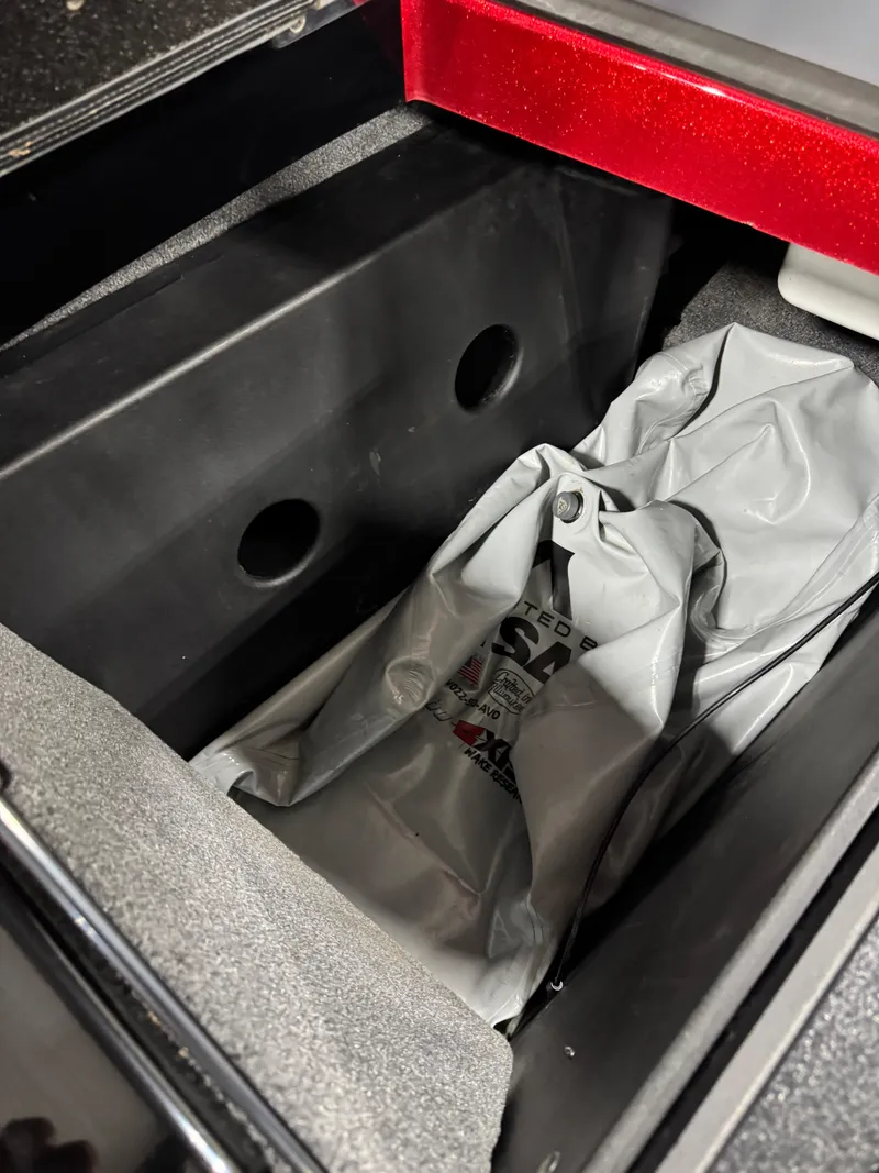 Slide: The Image of 2020 Malibu Wakesetter 22 LSV storage compartment with gray bag inside. - 9