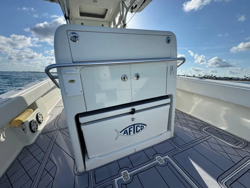 Slide: The Image of 2017 SeaVee 340Z boat interior with storage compartment, ocean view, and clear sky. - 11